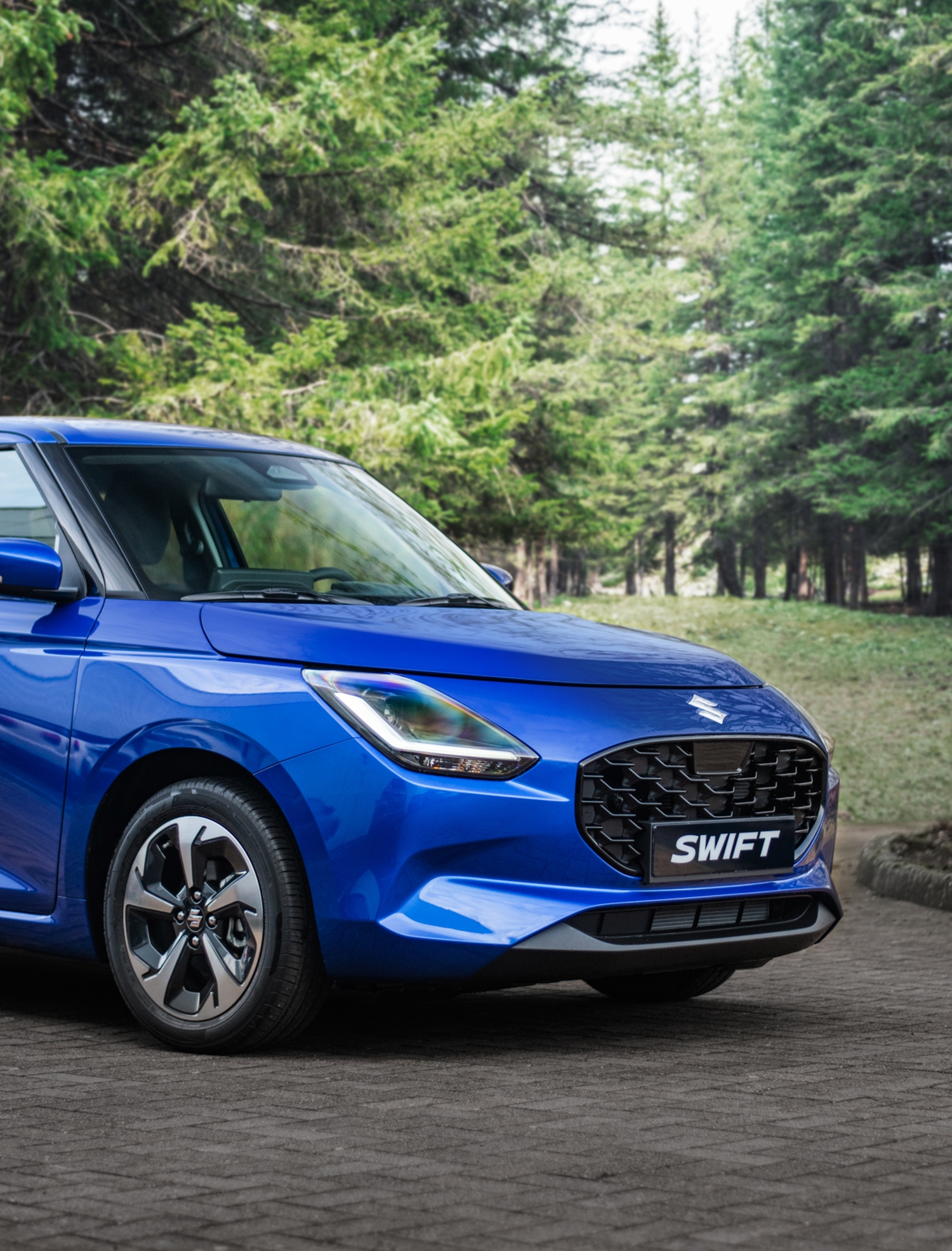 2024 suzuki swift blue side profile