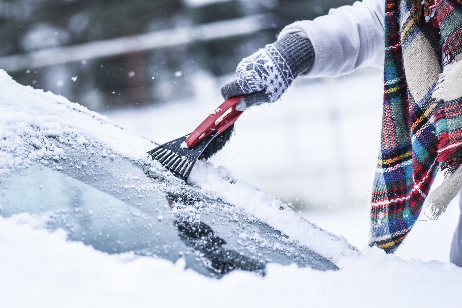 Scraping a windscreen clear